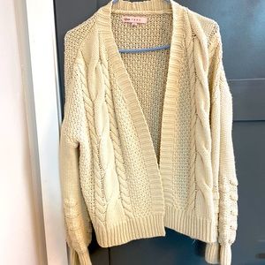 Cable knit cream colored cardigan. Warm and cozy